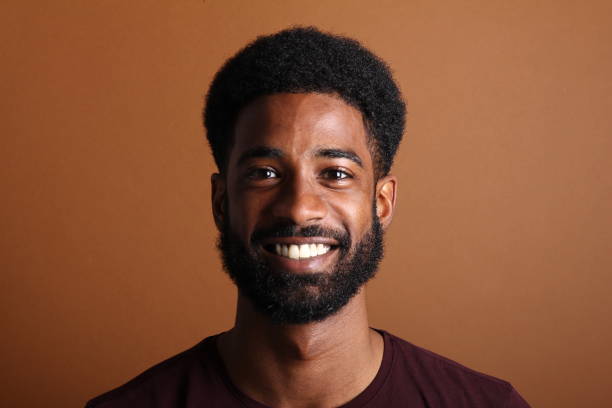 istock Beautiful black man in front of a brown background 1078454502