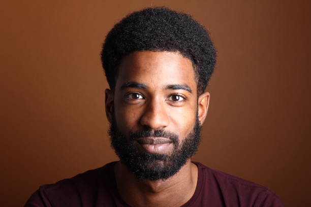 istock Beautiful black man in front of a brown background 1078454512