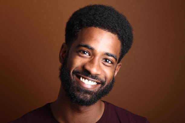 istock Beautiful black man in front of a brown background 1078454518