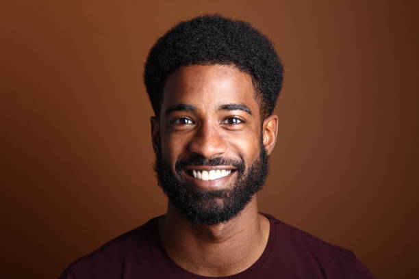 istock Beautiful black man in front of a brown background 1078454560