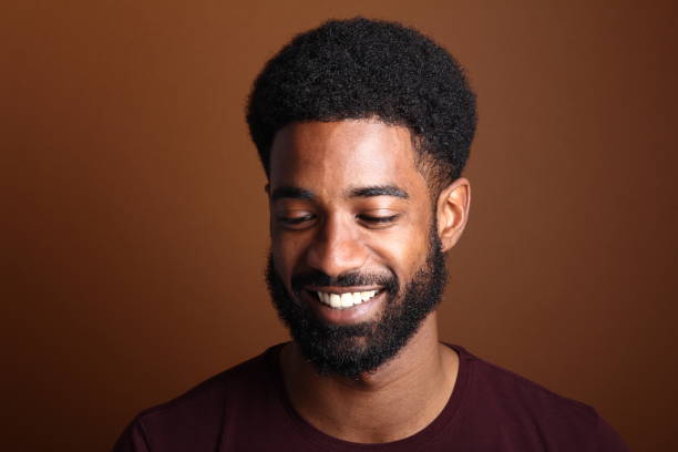 istock Beautiful black man in front of a brown background 1078454584