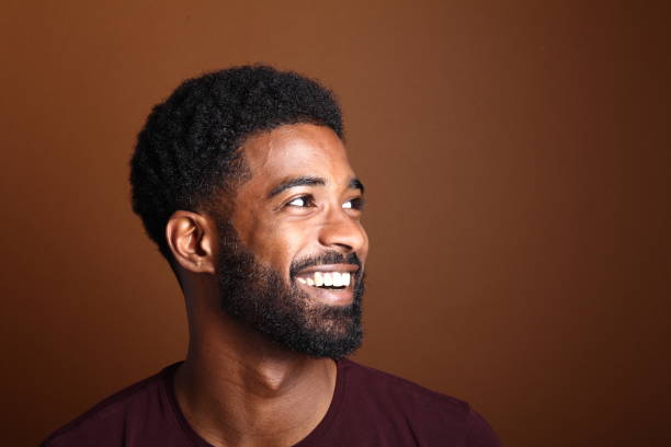 istock Beautiful black man in front of a brown background 1078455392
