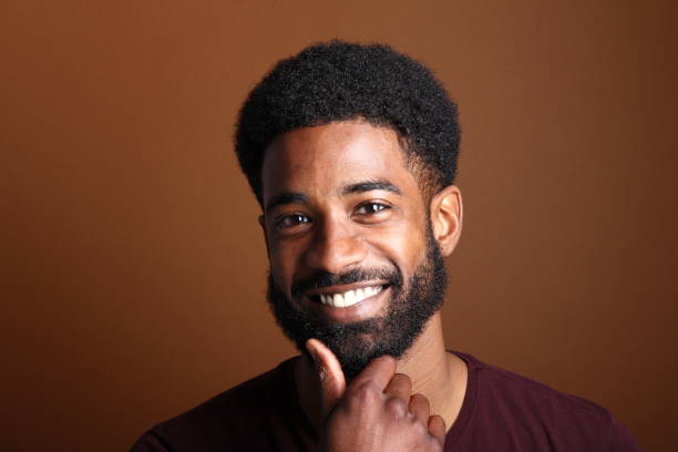 istock Beautiful black man in front of a brown background 1078455458