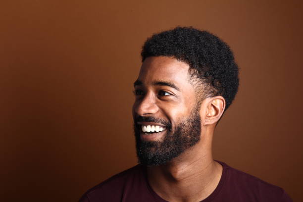 istock Beautiful black man in front of a brown background 1078455592