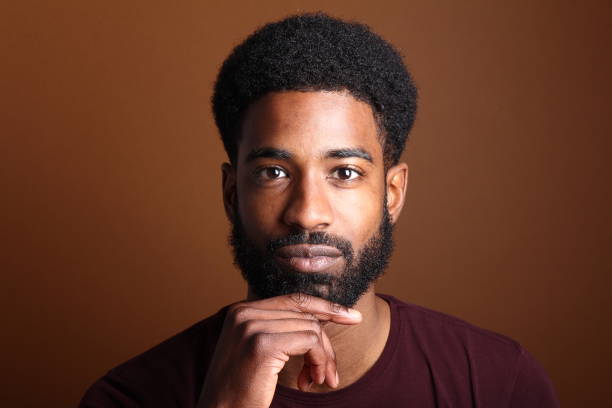 istock Beautiful black man in front of a brown background 1078455618