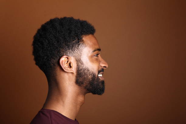 istock Beautiful black man in front of a brown background 1078455628