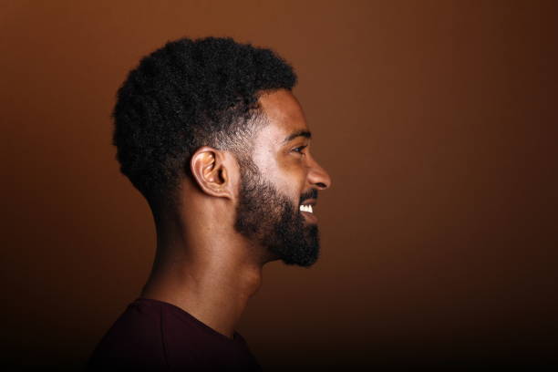 istock Beautiful black man in front of a brown background 1078455630