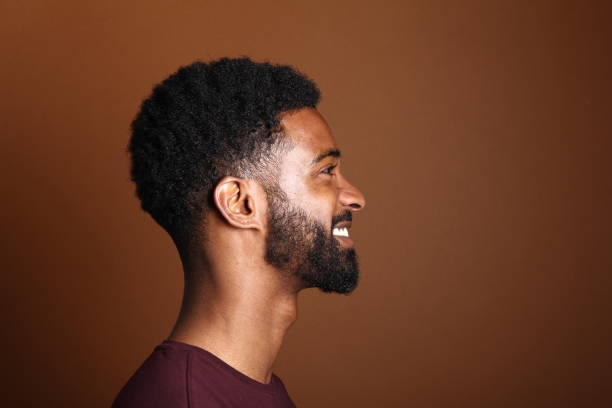 istock Beautiful black man in front of a brown background 1078455644