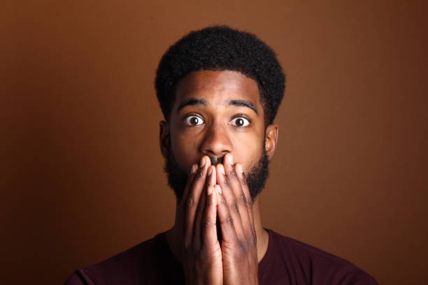 istock Beautiful black man in front of a brown background 1078455656