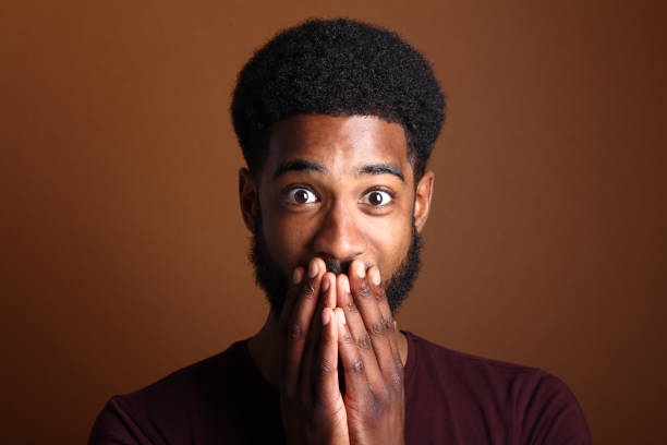 istock Beautiful black man in front of a brown background 1078455668