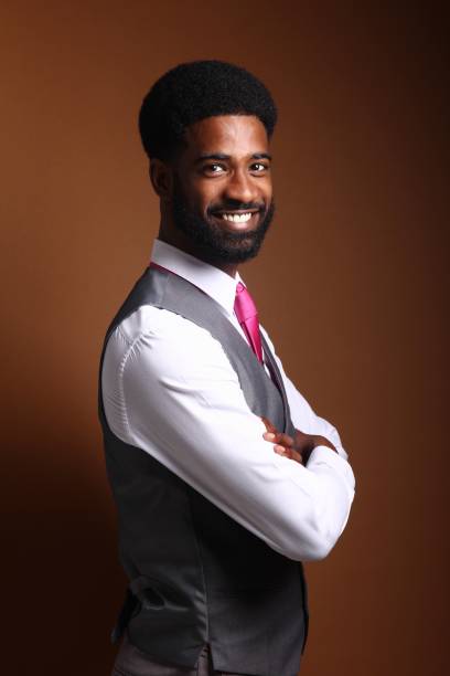 istock Beautiful black man in front of a brown background 1078455690