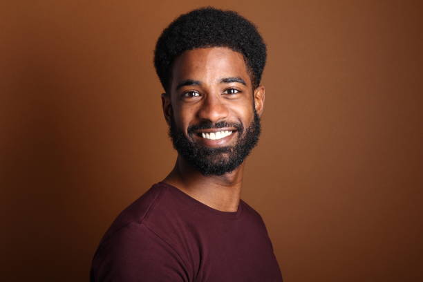 istock Beautiful black man in front of a brown background 1078455714