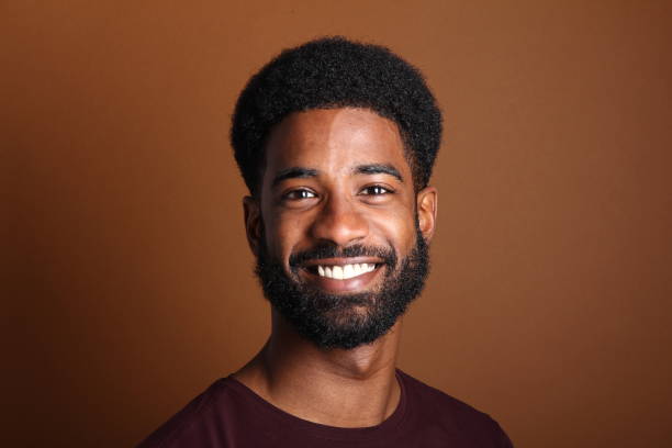 istock Beautiful black man in front of a brown background 1078455718