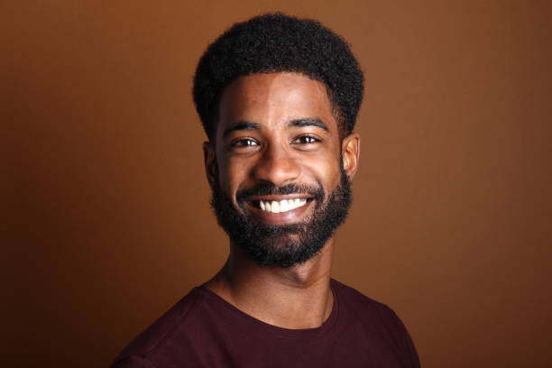 istock Beautiful black man in front of a brown background 1078455724