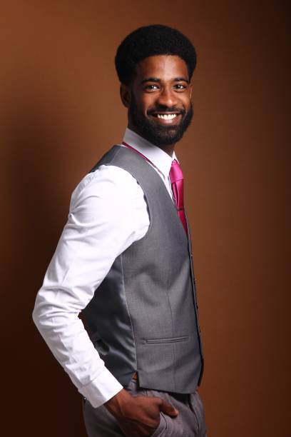 istock Beautiful black man in front of a brown background 1078455734