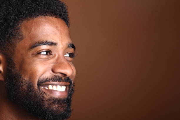 istock Beautiful black man in front of a brown background 1078455748