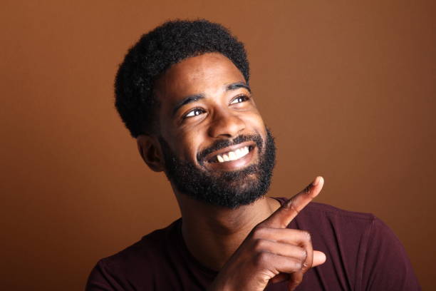istock Beautiful black man in front of a brown background 1078455756