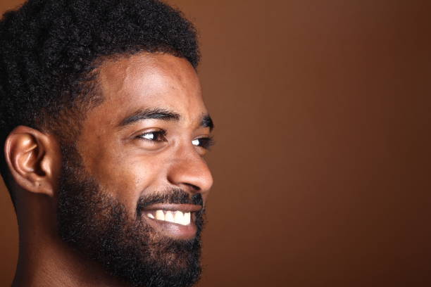 istock Beautiful black man in front of a brown background 1078455758