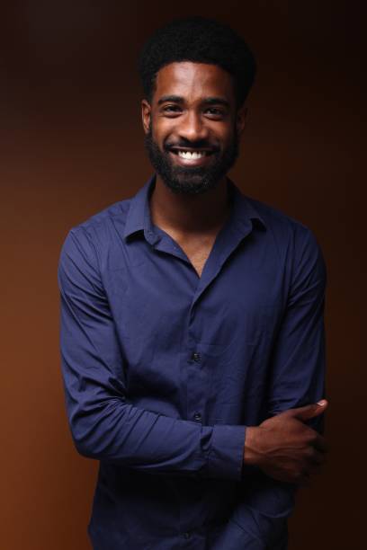 istock Beautiful black man in front of a brown background 1078456002