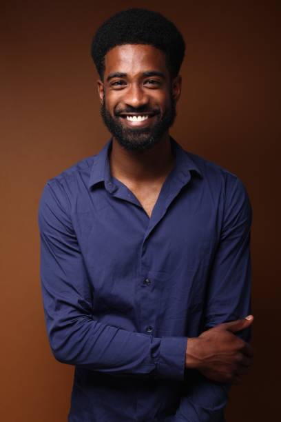 istock Beautiful black man in front of a brown background 1078456004