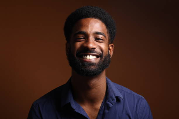 istock Beautiful black man in front of a brown background 1078456012