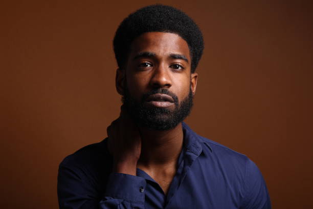 istock Beautiful black man in front of a brown background 1078456016
