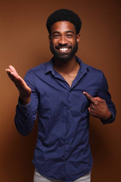 istock Beautiful black man in front of a brown background 1078456106