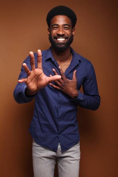 istock Beautiful black man in front of a brown background 1078456114
