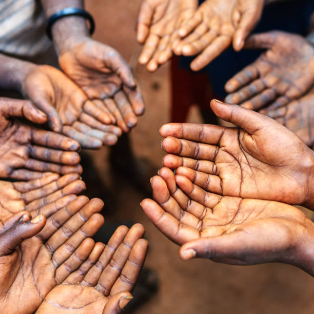 istock Hands of poor - asking for help, Africa 1078456178