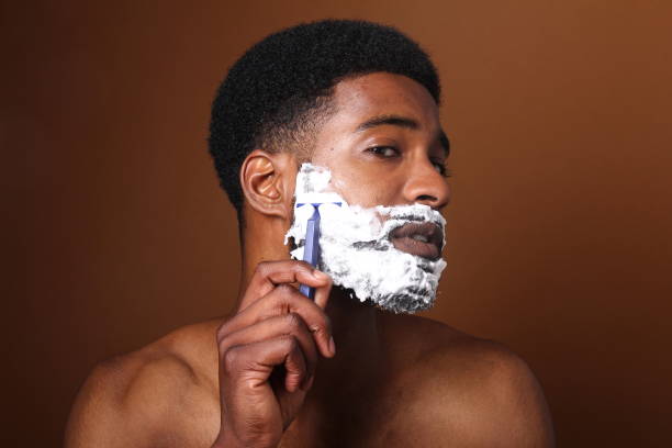 istock Beautiful black man shaving 1078456198