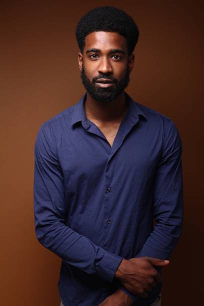 istock Beautiful black man in front of a brown background 1078456212