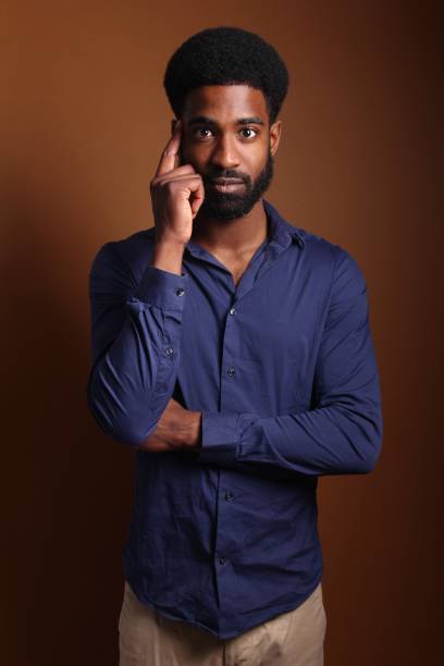 istock Beautiful black man in front of a brown background 1078456440