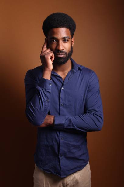 istock Beautiful black man in front of a brown background 1078456444