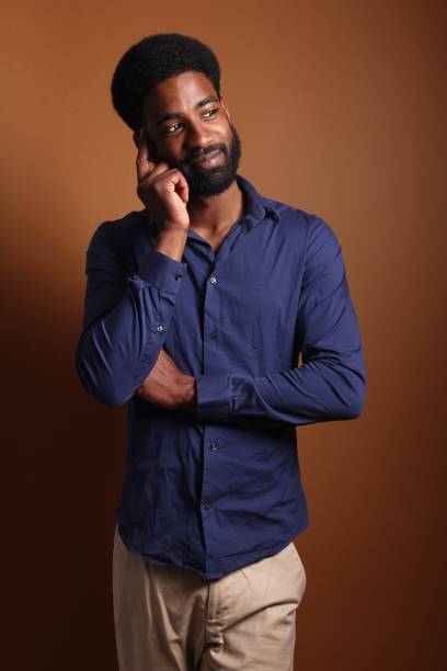 istock Beautiful black man in front of a brown background 1078456446