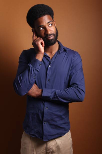 istock Beautiful black man in front of a brown background 1078456456