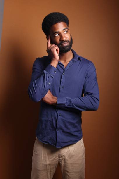 istock Beautiful black man in front of a brown background 1078456458