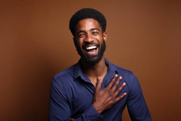 istock Beautiful black man in front of a brown background 1078456528