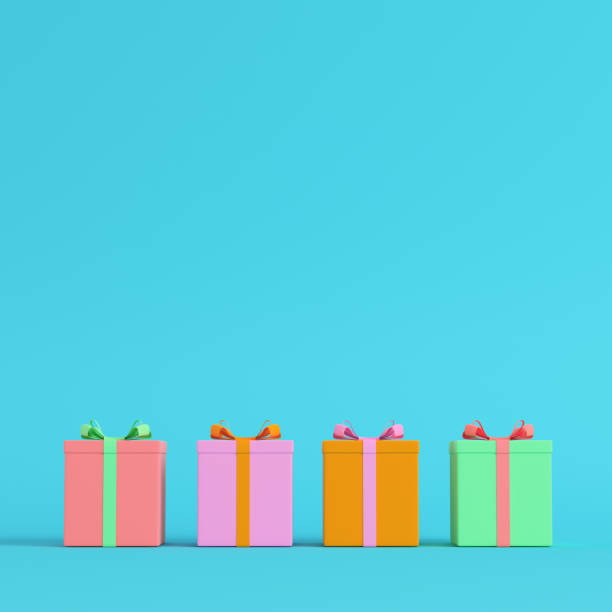 istock Four colorful gift boxes with ribbon bow on bright blue background in pastel colors 1078462554