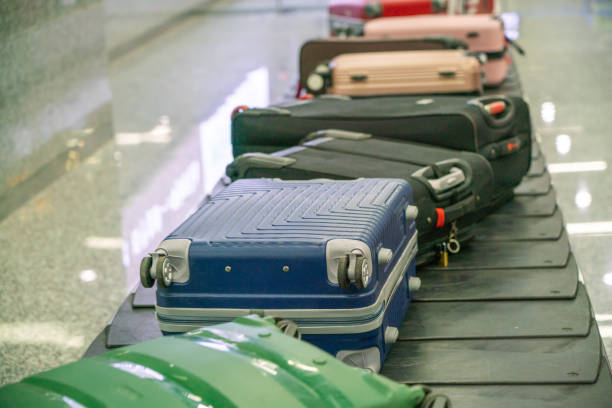 istock Suitcases on Baggage Claim Conveyor Belt at Airport 1078462964