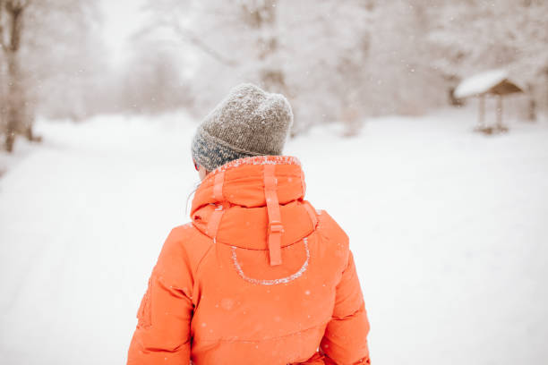 istock Woman walking through deep  snow on mountain 1078466266