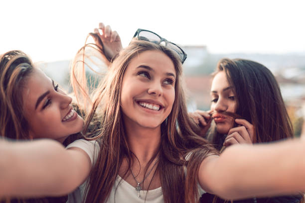 istock Female Highschool Taking Funny Selfie 1078471192