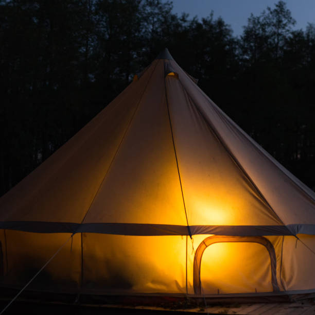 istock Traditional bell tent glows at night 1078472218