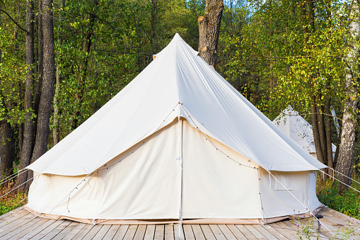Canvas glamping bell tent at forest