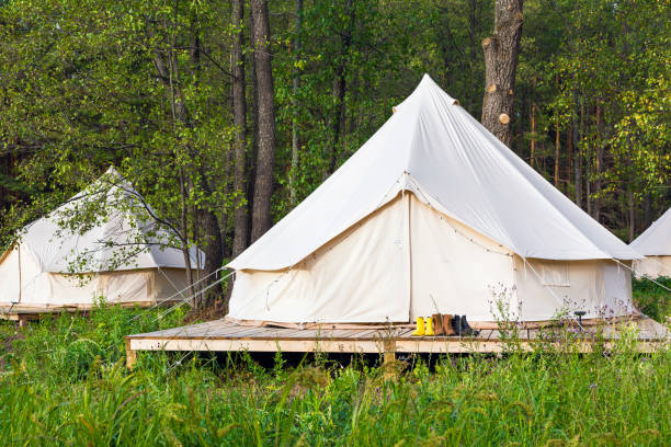 istock Two canvas bell tents outdoors at forest 1078472400