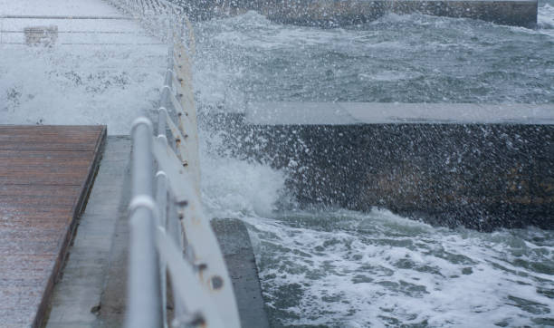istock sea waves crash on wooden deck 1078476198