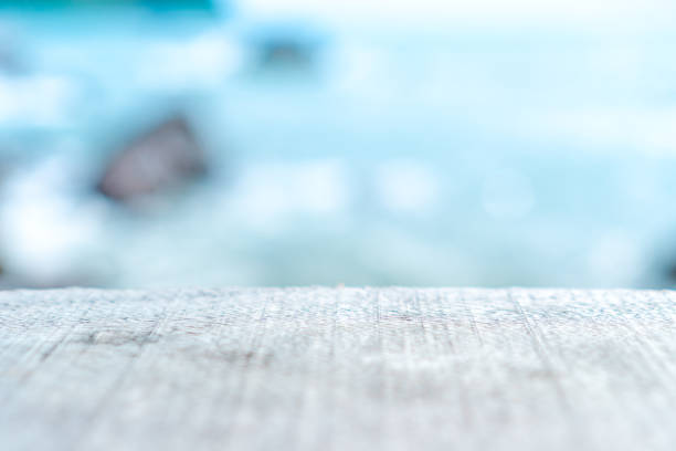 istock Selective focus of old wood table with blur beautiful beach background for display your product. 1078478114