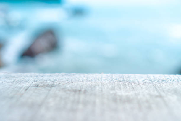 istock Selective focus of old wood table with blur beautiful beach background for display your product. 1078478124