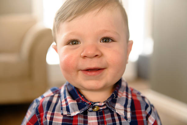 istock child boy standing up in at home 1078479030