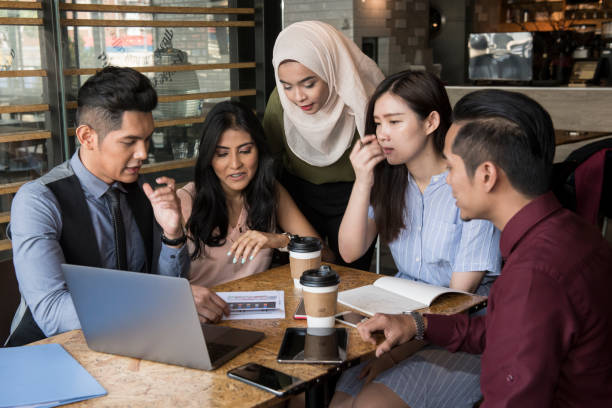 istock Young people conducting meeting in cafe and office 1078481894