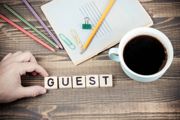 istock Guest. Wooden letters on the office desk 1078482902